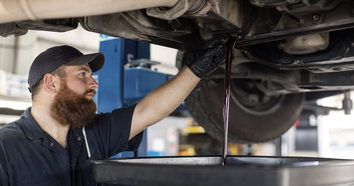 When should you schedule an oil change based on mileage or time?